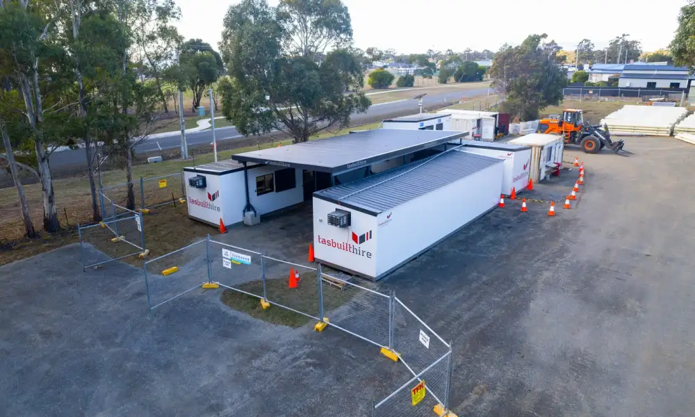 Aerial view of Tasbuilt Hire’s custom site setup in Orford, showcasing four modular units, including two site offices, a crib room, an ablution block, and an undercover area.