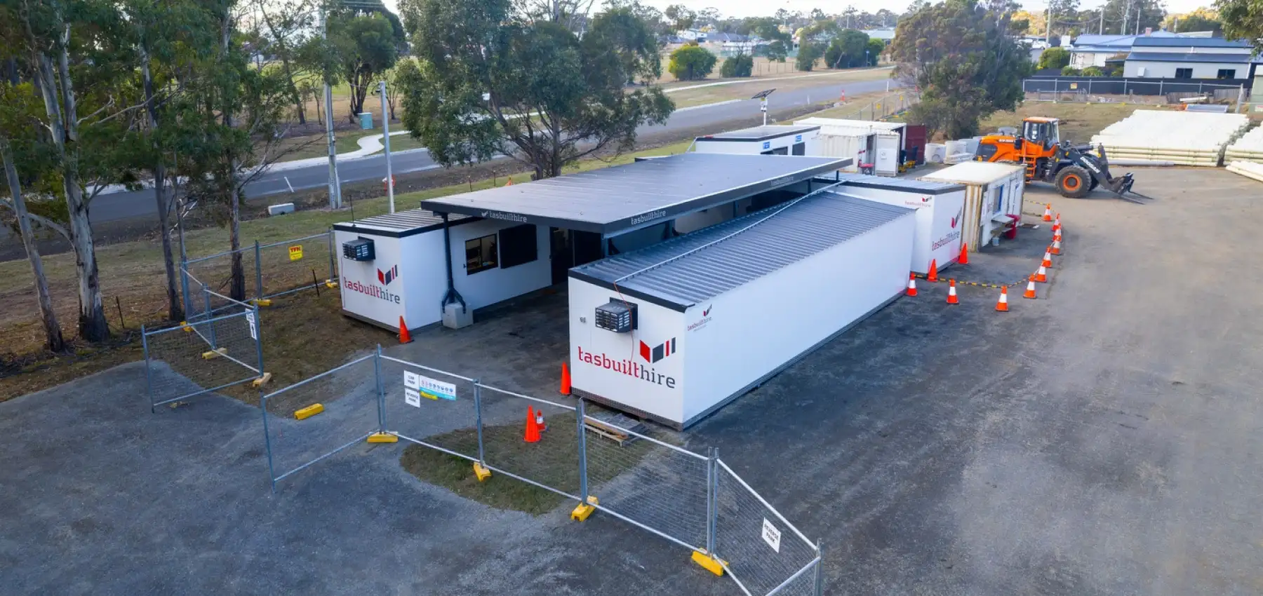 Aerial view of Tasbuilt Hire’s custom site setup in Orford, showcasing four modular units, including two site offices, a crib room, an ablution block, and an undercover area.