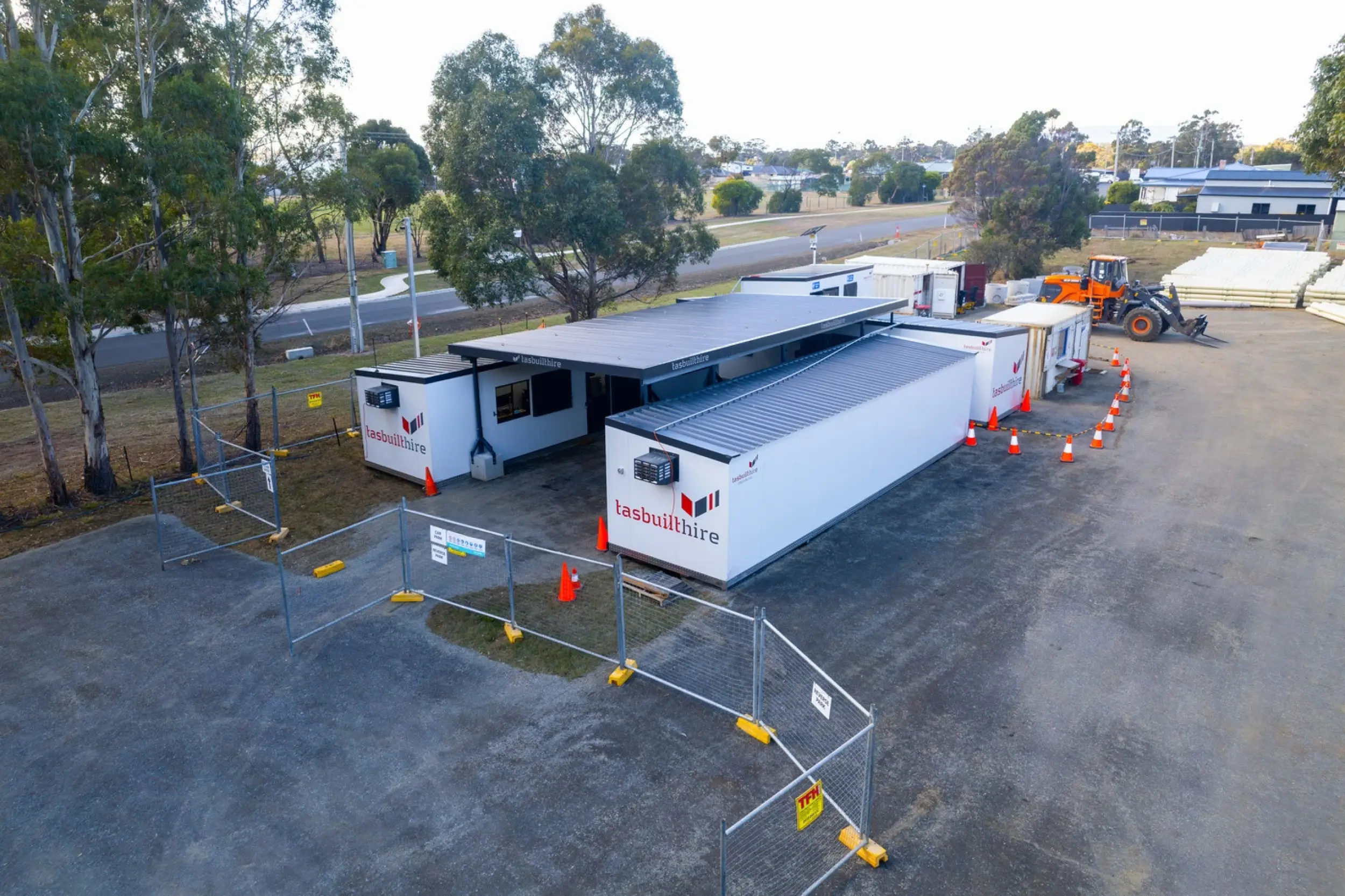 Aerial view of Tasbuilt Hire’s custom site setup in Orford, showcasing four modular units, including two site offices, a crib room, an ablution block, and an undercover area.