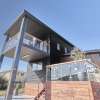 Two storey home with glass balustrade