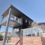 Two storey home with glass balustrade