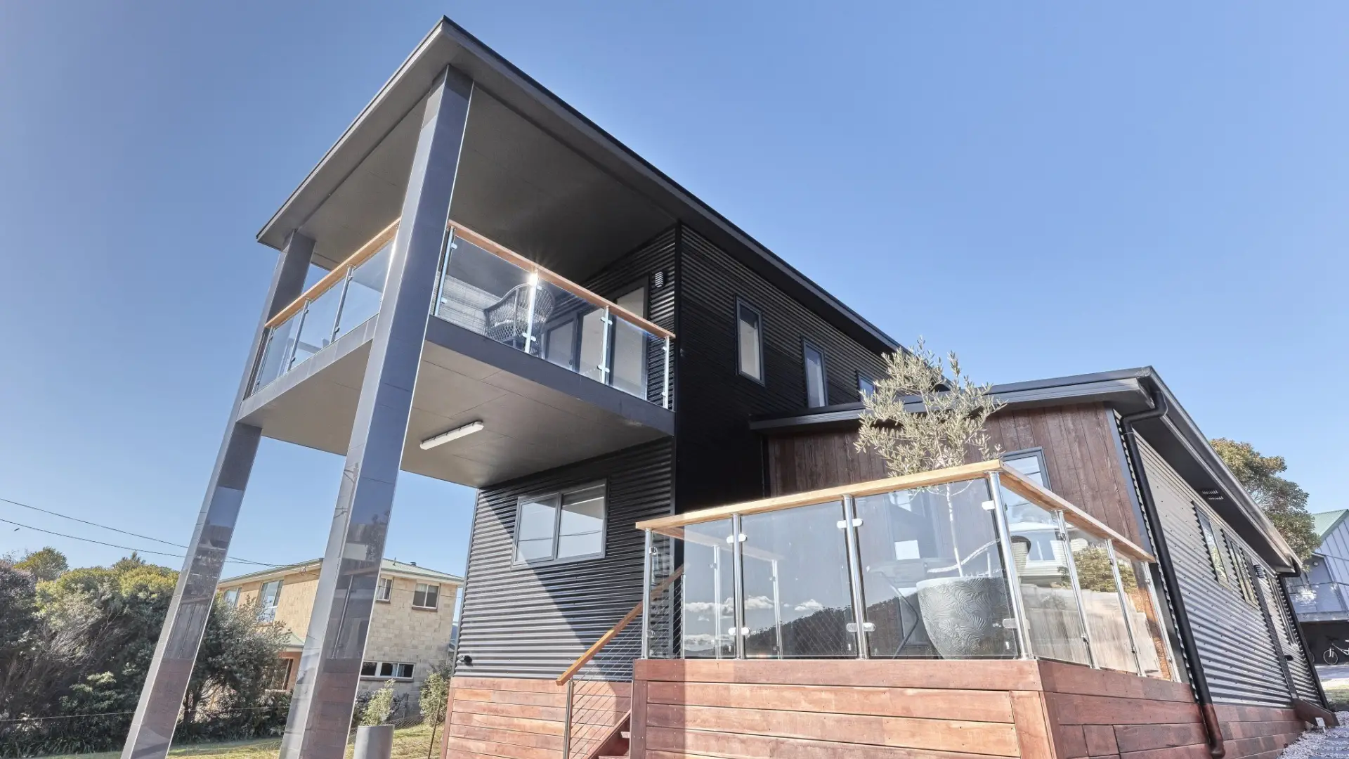 Two storey home with glass balustrade