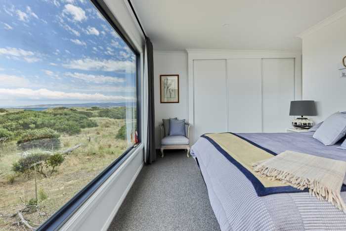 Modern bedroom with coastal views