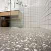 Grey speckled floor in bathroom