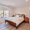 Timber vinyl flooring in bedroom with large walk in robe