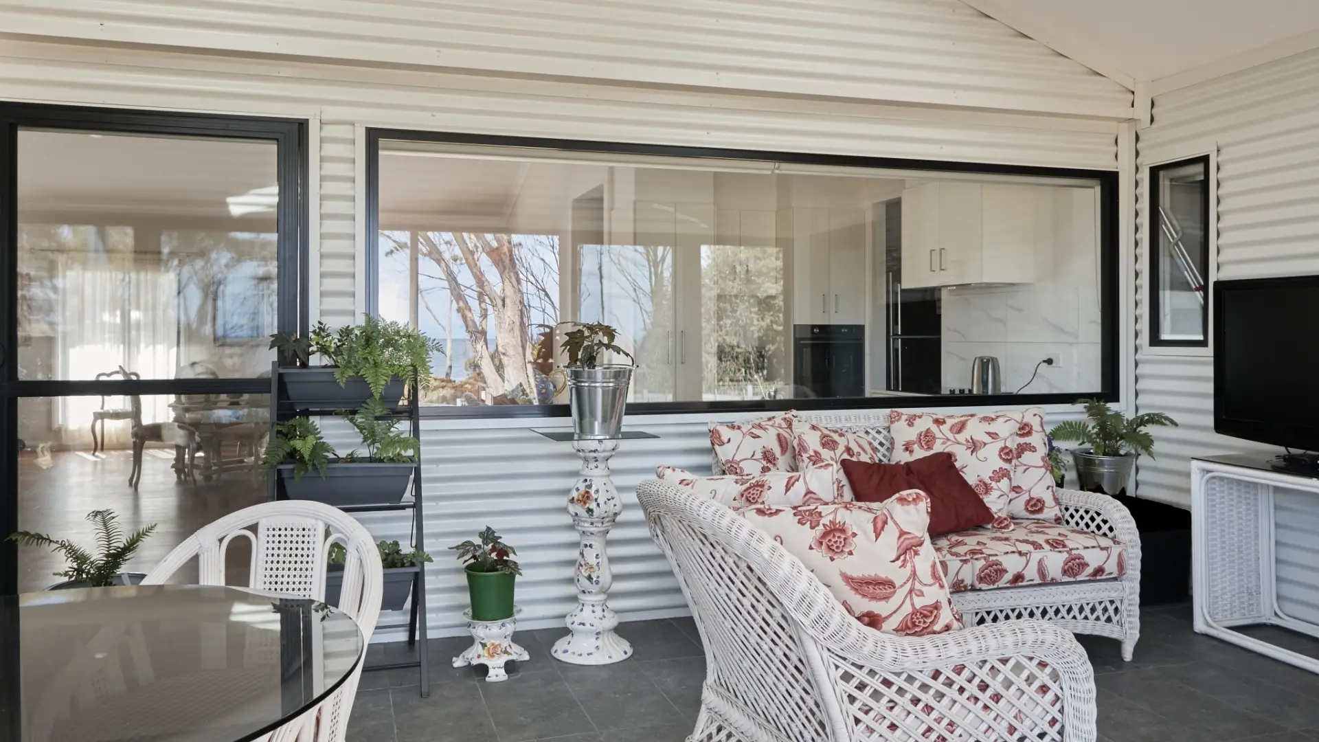 Sun room with fernery and out door space