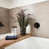 Rustic bath with beige tiles