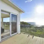 Deck with Modwood decking and glass rail