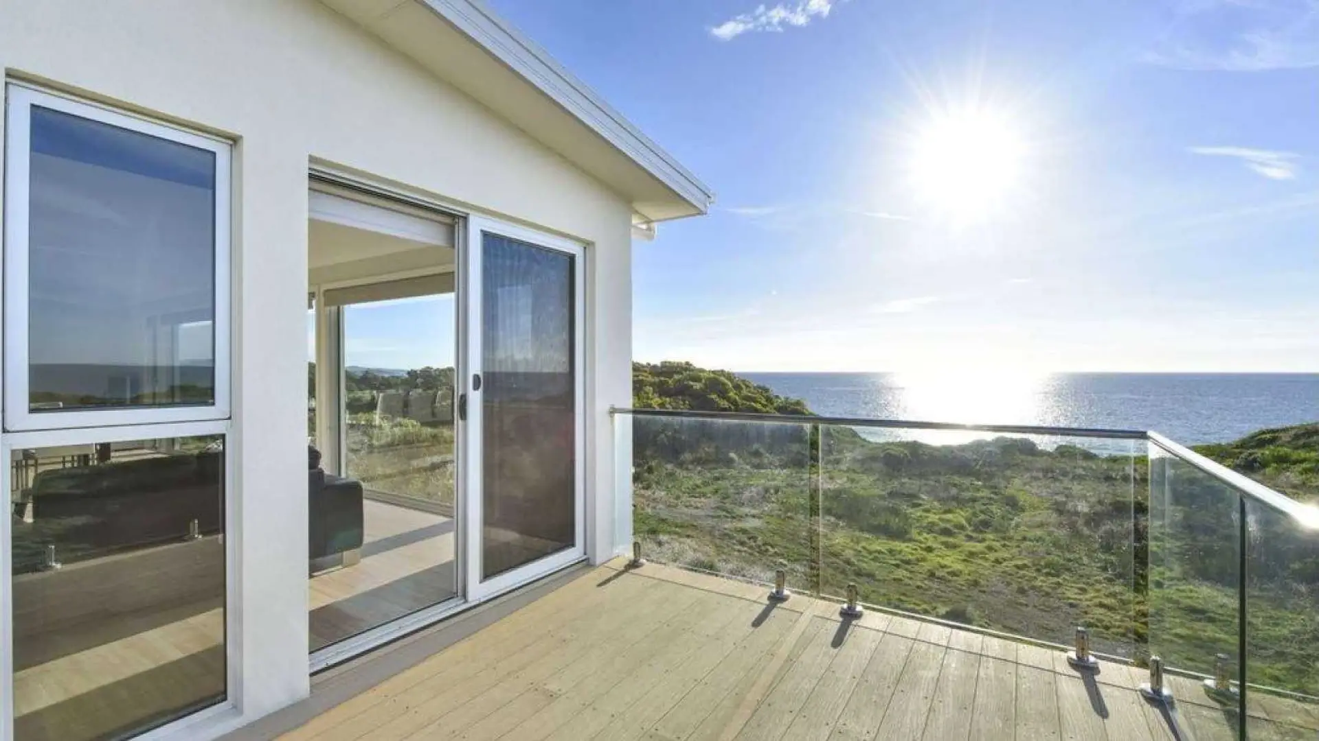 Deck with Modwood decking and glass rail