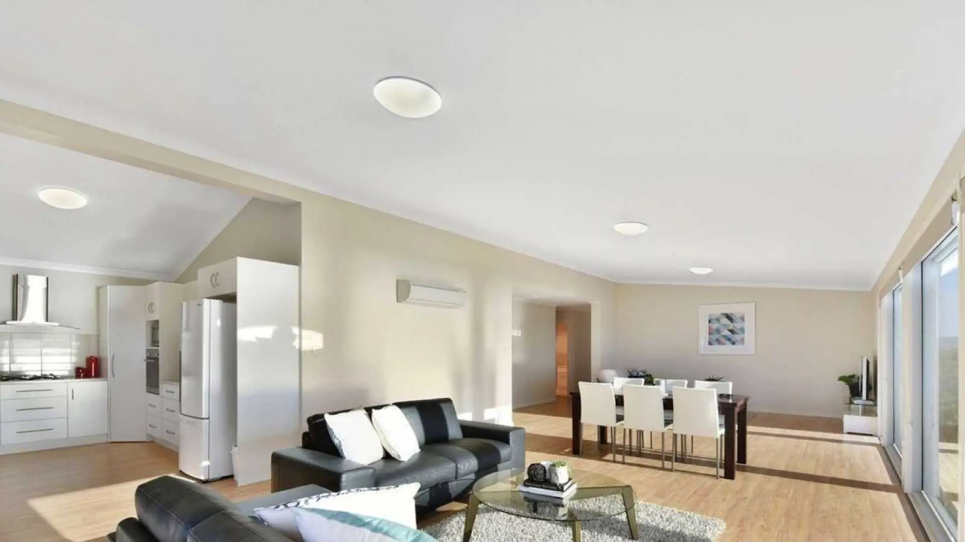 Open plan kitchen and living with timber floor