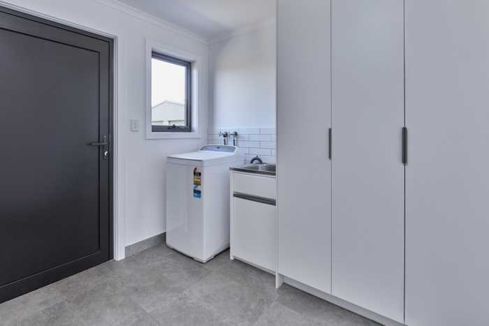 Small Laundry with Large Storage Cupboards