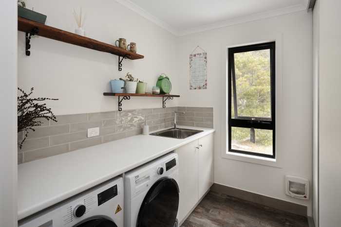 Small Laundry with Open Shelving