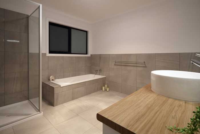 Roomy Grey Bathroom with Tiled Bathtub