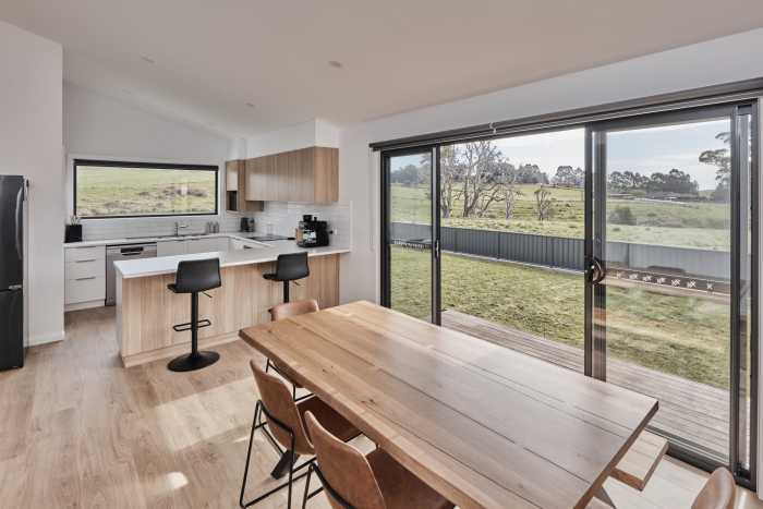 Open Plan Kitchen and Dining with Timber Flooring