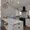 Country style kitchen with pressed tin splashback