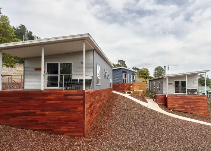 An external view of modular tourism lodgings and a dedicated bike store facility located in North East Tasmania.