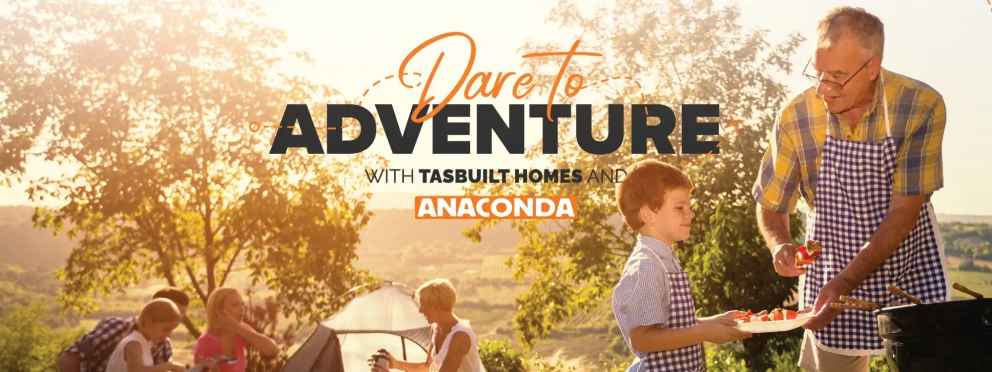 A family enjoying an afternoon camping trip at sunset, with a grandfather serving BBQ food to a grandchild, featured in Tasbuilt Homes’ 2025 spring promotion, shared by Tasbuilt Commercial.