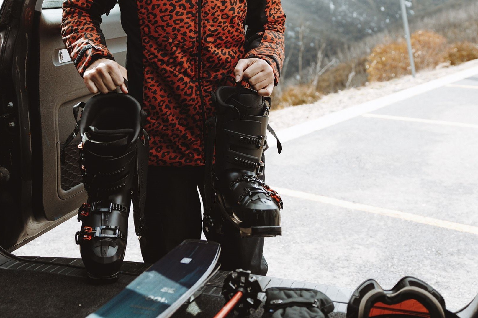 A person preparing for skiing in snowy conditions, highlighting Tasmania’s alpine environments.