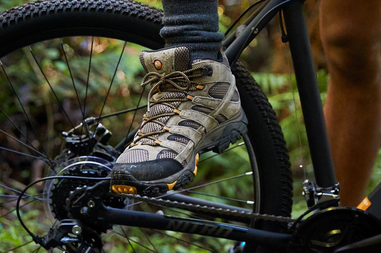 Outdoor boots worn for trail biking, symbolising durability and adaptability to rugged Tasmanian conditions.