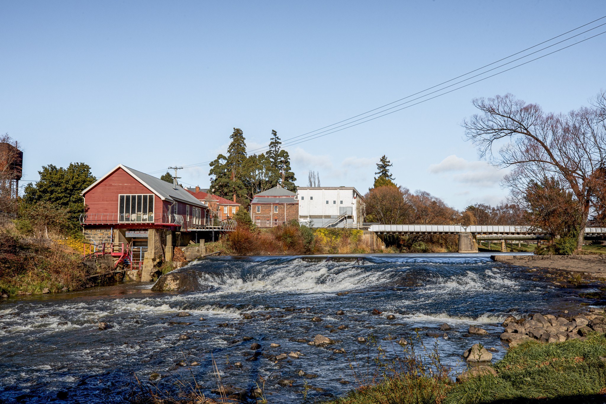 The scenic Deloraine riverbank lined with heritage buildings, capturing the charm of Tasmania’s top small town.
