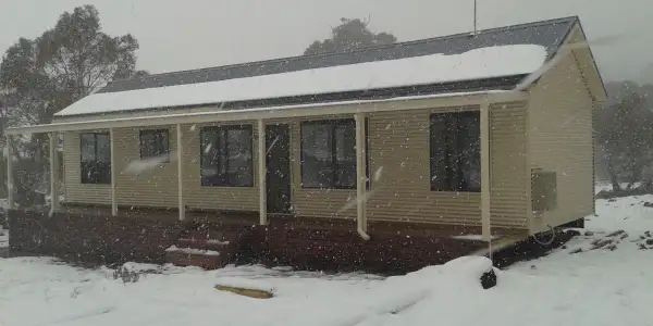Spring Snow Fall Lands on New Tasbuilt Cabin